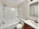 Bathroom featuring a tub and shower combination with white tile surround at 11712 Battery Pl, Charlotte, NC 28273