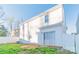 Exterior of a two-story home with a sliding glass door leading to a fenced backyard at 2009 Amos Oaks Ln, Charlotte, NC 28215