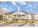 Attractive, single-story building with a clock tower, well-manicured lawn, and symmetrical landscaping at 2009 Amos Oaks Ln, Charlotte, NC 28215