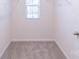 A walk in closet with carpet, window and shelving at 2009 Amos Oaks Ln, Charlotte, NC 28215