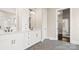 Bathroom featuring double vanity, lots of cabinet storage, and herringbone tile floors at 2017 Belle Grove Dr, Waxhaw, NC 28173