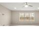 Bedroom with a large window and a ceiling fan at 2017 Belle Grove Dr, Waxhaw, NC 28173