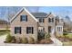 Charming brick home with black shutters, manicured landscaping, and a welcoming entrance at 2017 Belle Grove Dr, Waxhaw, NC 28173