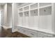 Bright mudroom with custom built-ins, bench, and storage at 2017 Belle Grove Dr, Waxhaw, NC 28173