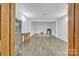 Finished basement with gray vinyl flooring and a safe, showcasing modern functionality at 298 Poplar Grove Ct, Taylorsville, NC 28681