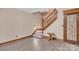 Finished basement area with stylish wood-look floors and wooden staircase at 298 Poplar Grove Ct, Taylorsville, NC 28681