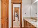 Bathroom entrance showing granite counters, wood trim, and tiled flooring at 298 Poplar Grove Ct, Taylorsville, NC 28681