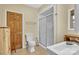 Well-lit bathroom featuring a glass-enclosed shower and tile flooring at 298 Poplar Grove Ct, Taylorsville, NC 28681