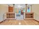 Arched doorway into a bedroom with wood floors, built-in shelves, and decorative columns at 298 Poplar Grove Ct, Taylorsville, NC 28681