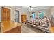 Comfortable bedroom featuring a bed, wooden dresser, and access to a private bathroom at 298 Poplar Grove Ct, Taylorsville, NC 28681