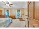 Bright bedroom featuring a ceiling fan, two windows for natural light, and vintage furniture at 298 Poplar Grove Ct, Taylorsville, NC 28681
