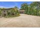 Long driveway leading to a home with lush landscaping and a two-car garage at 298 Poplar Grove Ct, Taylorsville, NC 28681