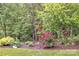 Lush garden area with a bird feeder and various flower bushes at 298 Poplar Grove Ct, Taylorsville, NC 28681