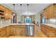 Bright kitchen with granite countertops, stainless steel appliances, and eat-in island at 298 Poplar Grove Ct, Taylorsville, NC 28681