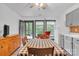Bright kitchen and dining area with checkered tablecloth and a view to the outside at 298 Poplar Grove Ct, Taylorsville, NC 28681