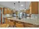 Well-equipped kitchen featuring granite countertops, stainless steel appliances, and custom cabinetry at 298 Poplar Grove Ct, Taylorsville, NC 28681
