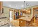 Stylish kitchen featuring granite counters, stainless appliances, and wood cabinetry at 298 Poplar Grove Ct, Taylorsville, NC 28681