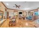 Open living room with stone fireplace, hardwood floors, and ample seating at 298 Poplar Grove Ct, Taylorsville, NC 28681