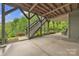 Covered patio with stairs and a view of the beautiful landscaped yard at 298 Poplar Grove Ct, Taylorsville, NC 28681
