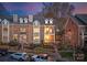 Attractive brick home with manicured landscaping, a private balcony, and well-maintained lawn at 415 Spring St, Davidson, NC 28036