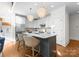 Well-appointed kitchen with stainless steel appliances, a center island, and elegant pendant lighting at 415 Spring St, Davidson, NC 28036