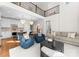 Open-concept living room and kitchen offering ample space and stylish decor with lots of natural light at 415 Spring St, Davidson, NC 28036