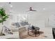 Spacious living room area with neutral colored furniture, overhead fan, and lots of light at 415 Spring St, Davidson, NC 28036
