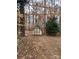 A shed is visible in the backyard surrounded by trees and foliage in the fall at 4825 Banfshire Rd # 28, Charlotte, NC 28215