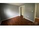 Bedroom with hardwood floors and a closet at 4825 Banfshire Rd # 28, Charlotte, NC 28215