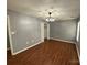 Bedroom with hardwood floors, neutral walls and modern ceiling fan at 4825 Banfshire Rd # 28, Charlotte, NC 28215