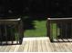 Wooden deck with railings overlooks the backyard at 4825 Banfshire Rd # 28, Charlotte, NC 28215