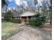 Charming brick home with manicured hedge, chimney, and a front porch at 4825 Banfshire Rd # 28, Charlotte, NC 28215