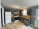 Kitchen with tile floors, gray cabinets, and stainless steel appliances at 4825 Banfshire Rd # 28, Charlotte, NC 28215