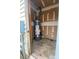 Small utility room with hot water heater and electrical panel; fair condition at 4825 Banfshire Rd # 28, Charlotte, NC 28215