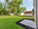 Spacious backyard with mature trees and outbuildings at 570 Key West Ave, Kannapolis, NC 28081