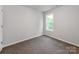 Bedroom has carpet, white walls, a window, and light-colored trim at 570 Key West Ave, Kannapolis, NC 28081