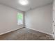 Bedroom with carpet, white walls, a window, and white trim at 570 Key West Ave, Kannapolis, NC 28081