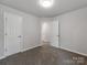 Neutral bedroom with carpet, white walls, and open door at 570 Key West Ave, Kannapolis, NC 28081