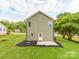 Exterior of home with green lawn, patio and trees at 570 Key West Ave, Kannapolis, NC 28081