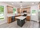 Modern kitchen featuring light wood cabinetry, white countertops, stainless steel appliances, and a functional island at 570 Key West Ave, Kannapolis, NC 28081