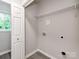 Laundry room with white shelving and vinyl flooring at 570 Key West Ave, Kannapolis, NC 28081