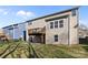 Back exterior featuring a deck and ample backyard space, perfect for outdoor activities and relaxation at 6004 Clover Hill Rd, Indian Trail, NC 28079