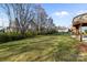 Expansive backyard featuring a lush lawn with a fenced-in area, providing privacy and space for outdoor enjoyment at 6004 Clover Hill Rd, Indian Trail, NC 28079