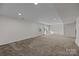 Unfinished basement space featuring neutral carpeting and recessed lighting, ready to be personalized at 6004 Clover Hill Rd, Indian Trail, NC 28079