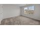 Spacious bedroom featuring large windows with an exterior view at 6004 Clover Hill Rd, Indian Trail, NC 28079