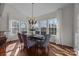 Bright dining room with many windows, chandelier, and ample seating perfect for Gathering gatherings at 6004 Clover Hill Rd, Indian Trail, NC 28079