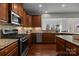 Gourmet kitchen features stainless steel appliances, granite counters, and ample cabinet space at 6004 Clover Hill Rd, Indian Trail, NC 28079