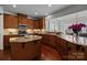 Modern kitchen with granite countertops, stainless appliances, and wood flooring offers luxury living at 6004 Clover Hill Rd, Indian Trail, NC 28079