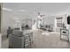Bright and airy living room featuring a ceiling fan and multiple seating areas at 6004 Clover Hill Rd, Indian Trail, NC 28079