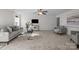 Open living room with neutral tones, ample seating, and natural light at 6004 Clover Hill Rd, Indian Trail, NC 28079